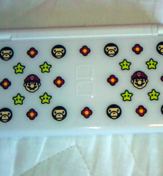 Illustration for article titled Curvy Japanese Bikini Lady Shows Us Bape Nintendo DS